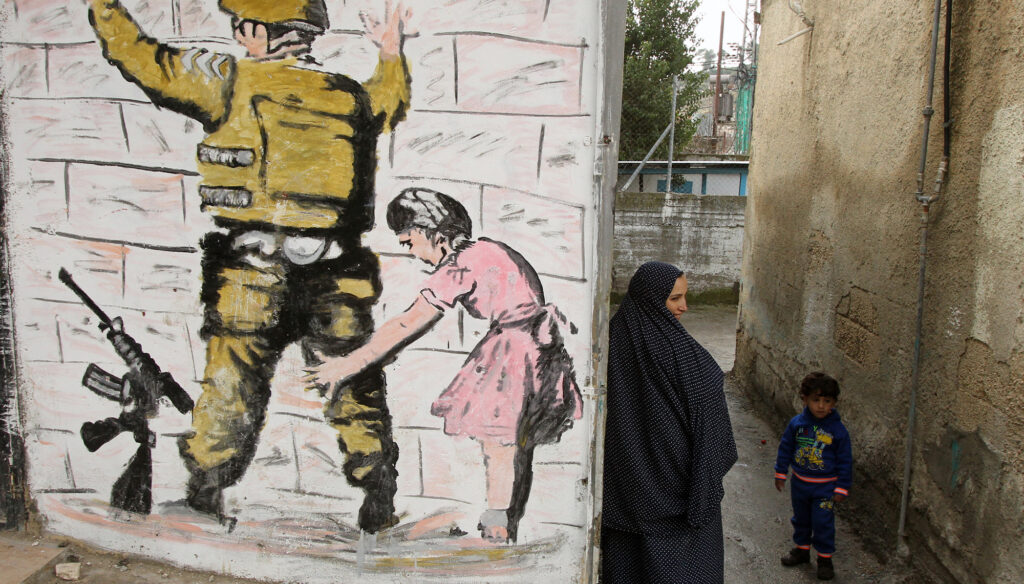 صورة الفلسطيني المذعن في أعمال بانكسي